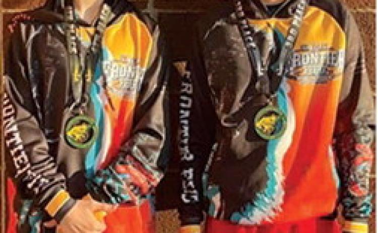 Lucas Natalini and Briggs Johnson, local mini wrestlers came away from the Bobcat Classic with third place and second place hardware, Saturday, in Basehor. Courtesy photo.