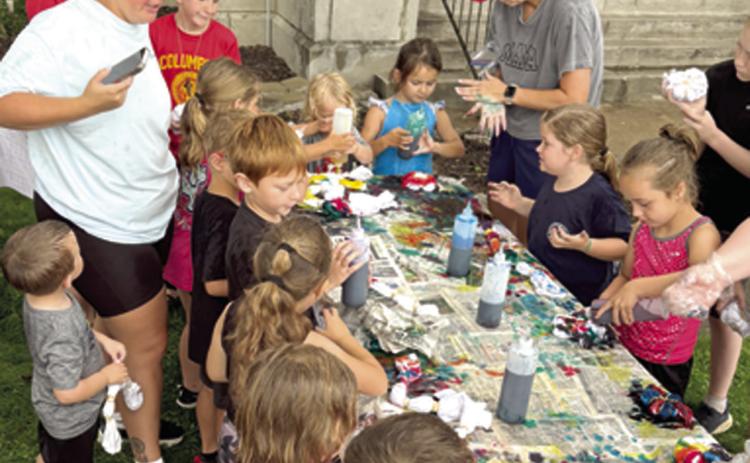 A bit of rain did not dampen the enthusiasm or spoil the fun for the youngsters at the library recently. Given white t-shirts, gloves and some dye children were encouraged to create a wearable masterpiece. A large number of youngsters showed up for the tie dye shirt event.