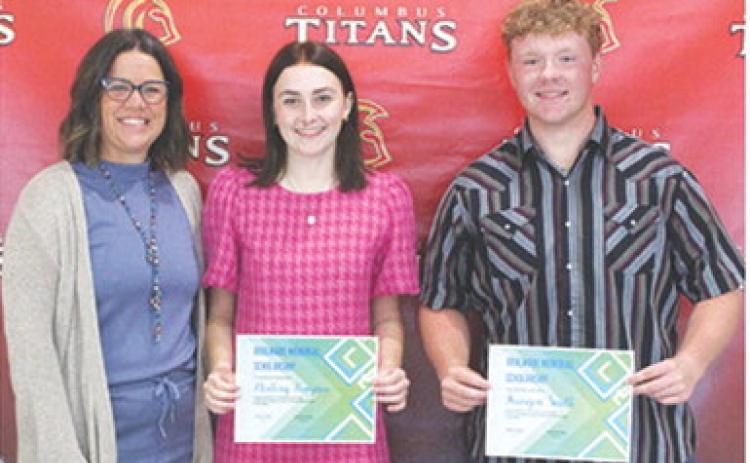 Mallory Thompson and Kanyen Smith received the Boulware Family Scholarship in the amount of $1,050 each from USD 493 Instructor, Kelly Walters during the 2025 Senior Assembly, May 16, at the Columbus Unified High School Gymnasium.