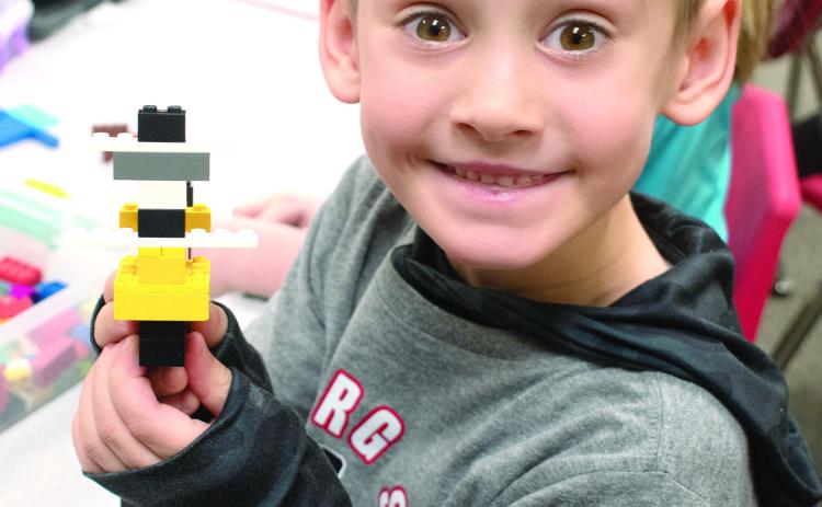 USD 493 students at Park Elementary took part in a number of activities related to the recent celebration of Kansas Day. Rowan Benedict shows off his interpretation of the Kansas State Salamander.