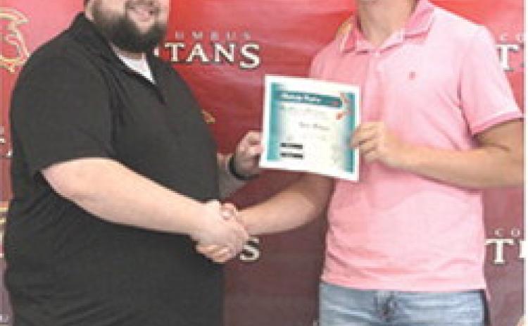 Kyler Rahmeier received the First Christian Church Scholarship in the amount of $500 from FCC Pastor, Cody Bohall, during the 2025 Columbus Unified High School Senior Assembly, May 16, at the CUHS Gymnasium.