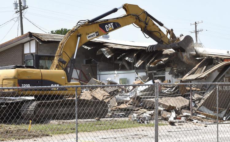 Another building of Columbus’ yesteryear has been reduced to rubble. The former health department located on East Walnut was razed on Monday by workers of B-3 Construction. A new structure is slated to be erected later this year and will house the Cherokee County Health Department.