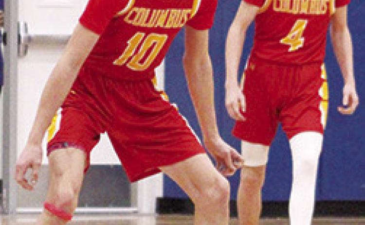 Titan Senior, Derek Krause, and sophomore, Cooper Bush, set up for defense in the final minutes of the Kansas Class 3A Sub-State quarterfinal loss to the Rams in Riverton, 47-69, Monday. Columbus ended their season with a 5-15 record. Riverton advanced to play Frontenac last night at Caney Valley High School. Scores were not available at press time.