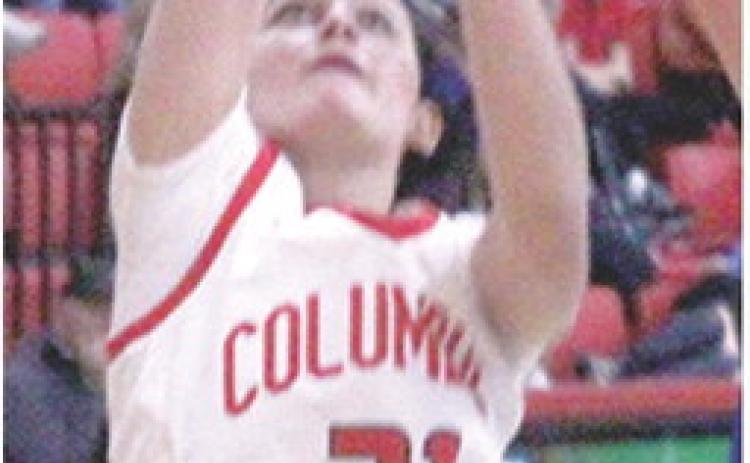 Sophomore, Americus Woodcock, shoots for two in a recent home game vs. Colgan. Friday in Riveton, Americus led the Lady Titan Junior Varsity to a 3027 win over the Lady Rams.