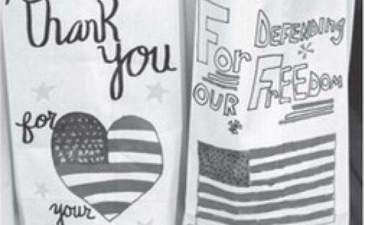 Last year local students decorated the sacks used to pack the lunches for veterans and first responders. This year the event will be a drive through event at the Lions Shack.