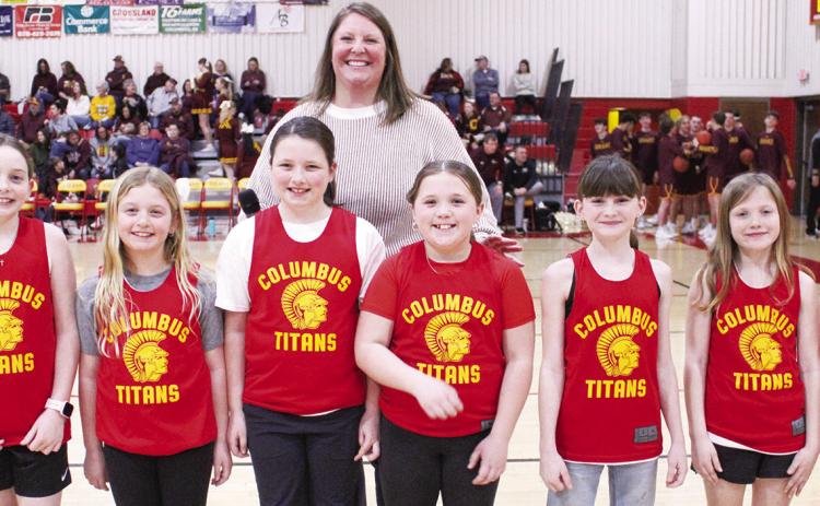 Members of the Columbus Recreation Commission’s Lady Titan League were introduced during the CUHS Basketball game with Girard in February. Members of the third grade Lady Titan Team are Willow Patton, Peyton Hayes, Teagan Jarrett, Wren Ellis, Andi Parsons, Hadley Bessman, and Mariah Moser. Teammates not pictured are Carrie Mooreman, Hayven Griffoth, and Shay Neely. The team is coached by Anna Moser, above. Lance Moser and Vanessa Jarrett also coached the team. Morgan Moser served as assistant coach.