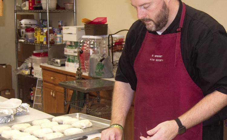 St. Bridget’s Catholic Church held their annual Oktoberfest dinner on Sunday with a special treat from Father Chris Martin as he prepared the bierocks filling using his grandmother’s recipe.