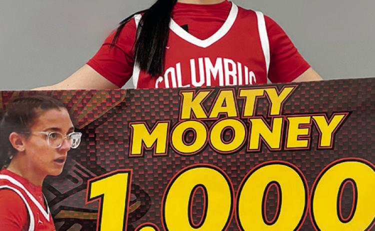Columbus Lady Titan Senior, Katy Mooney, reached 1,000 career points in the win at Baxter Springs, Monday. Katy needed ten points going in to the game and picked up the record breaker at the end of the first half. She tallied 20 points for the game.