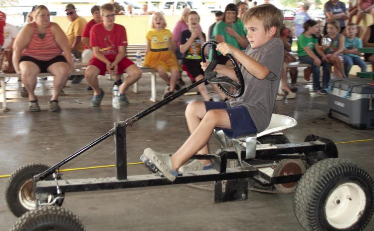 Tractors used in the pedal tractor pull vary depending on the age of the entrant. Older children get to try their hand at this tractor. Winners in each division have the opportunity to compete at the Kansas State Fair.
