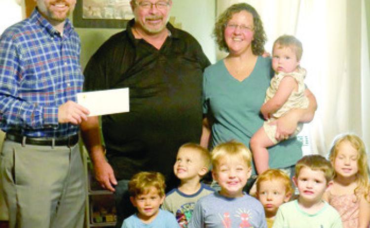 Candice Anderson’s Little Blessing Day Care in Baxter Springs, received a grant from Community Foundation of Southeast Kansas (CFSEK) for outdoor toys, storage and nap mats. Devon Gorman with CFSEK presented the check.