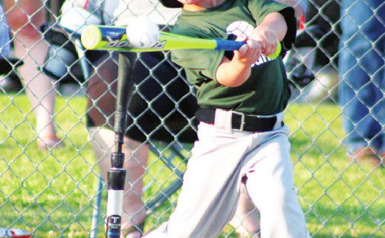 Baylor Bowman makes good contact for a big hit in Columbus Cal Ripken T-Ball action at the Community Field Ball Park.