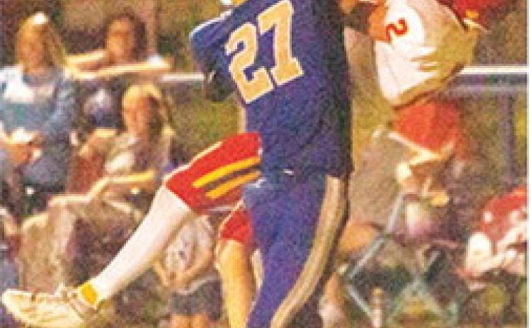 Titan Senior, Carter Woodcock, went up high and came down with the catch in the end zone, early in the fourth quarter, increasing the Titan lead over the Rams, 39-21 in Riverton. Senior, Riley Greer, attempts to defend for the home team. Photo by Kristin Sharp