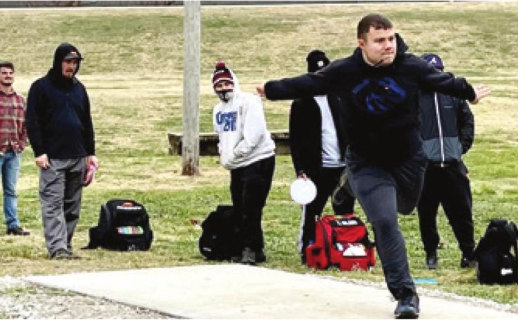 Gabe Shelton was first up to throw during the Run for the Roses. It takes power, determination and technique to throw a disc accurately. Photo by Dee Riley.