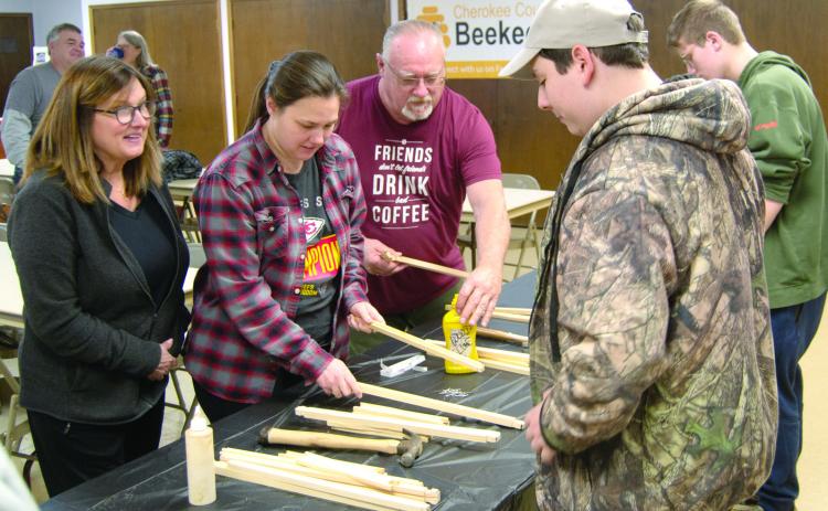 Everyone was busy as bees during the Cherokee County area Beekeepers club meeting as they were building frames to put in the hive box which was given away.