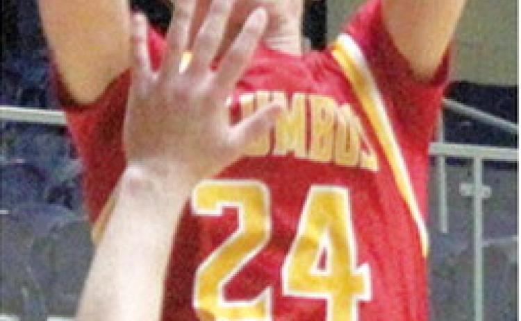 Columbus Titan Sophomore, Kooper Saiz, shoots for two points over Galena Senior, Jack Perry, in the Class 3A Quarterfinal loss in Galena, Friday, 42-75.