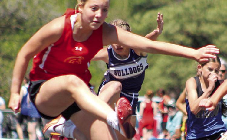 Lady Titan Brinleigh Meyer clears the hurdle during the Columbus Invitational, April 20, at the Central School Track. Thursday, she won the 100 Meter Hurdle event at the Frontenac Invitational with a time of 18.41 seconds and was a member of the 4x200 Meter Relay Team that also placed first at Frontenac. The Columbus seventh grader placed fifth in the 400M Dash and sixth in the 100M Dash.