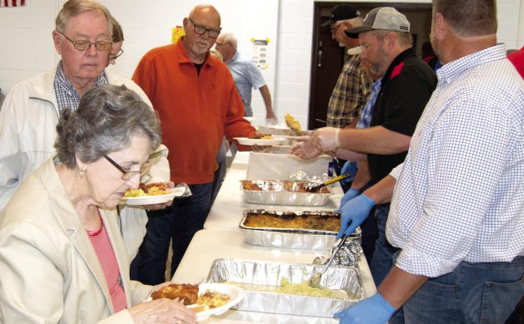 Farmers Coop board members served members a chicken dinner on Friday evening