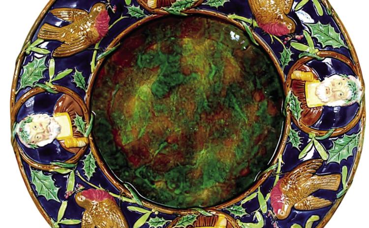 Victorian English majolica maker George Jones decorated this platter with English Christmas symbols that may be unfamiliar to Americans, but still have the spirit of the holiday. Photo Credit: Strawser Auction Group (c) 2024 by Cowles Syndicate Inc
