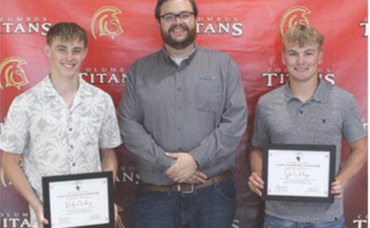 Korbyn Newberry and Syler Schuberger were the recipients of the Heartland Scholarships in the amount of $1,000 each from Heartland Representative, Doug Graham at the Senior Assembly, May 16, in the CUHS Gymnasium.