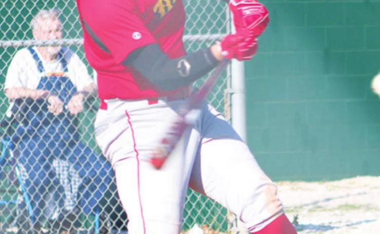 Titan Junior, Brett Hamilton, gets a hit in a recent game at Labette County. Brett was one of three Titans with home runs in the shutout over the Chargers, 17-0, Thursday, in Cherryvale.