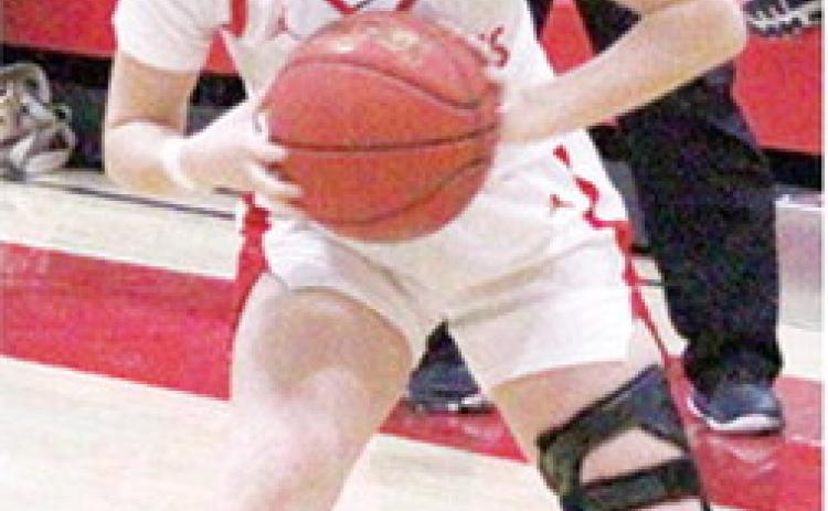 Lady Titan Senior, Torey Tedlock, looks to pass in a recent home game. Torey had six points in Tuesday’s loss to New Heights in the Lancer Classic.