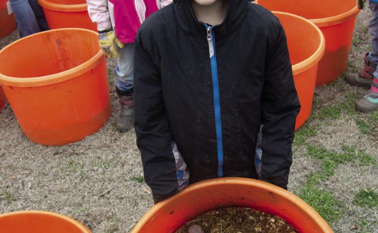 It was a chilly day to plant potatoes