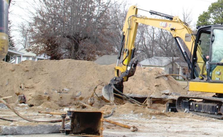 Workers began removing abandoned gasoline storage tanks