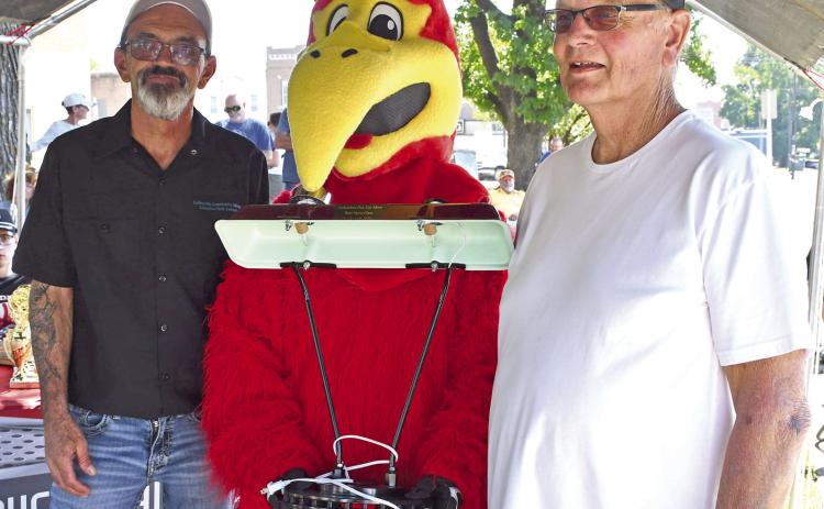 The Annual Columbus Days Car Show saw new faces and prizes this year as the event was hosted by Coffeyville Community College and Sally Davis Real Estate. Jason Spainhower and the Coffeyville Raven present the Top award in the “Other” Category went to Dave Baker with his 1942 B. This lamp made from various car parts was designed and built by Automotive Collision instructor and Columbus resident Hal Daniels.