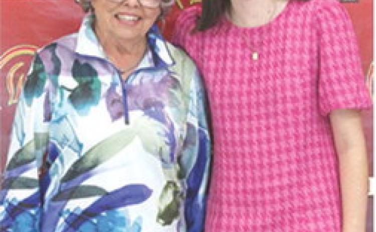 Mallory Thompson was the recipient of the $500 PEO Scholarship during the Senior Assembly, May 16. Marylin Shumake presented the award at the Columbus Unified High School Gymnasium.