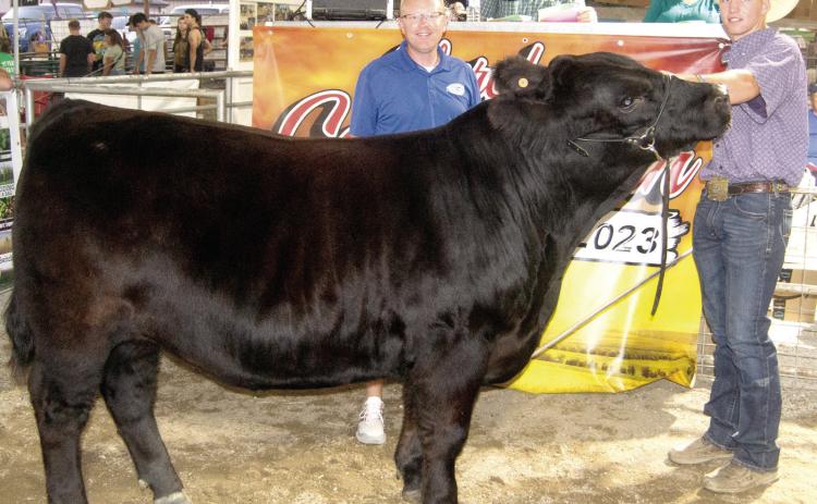 For the second consecutive year Cole Youngblood, a member of the Columbus FFA, showed the Grand Champion Market Beef at the Cherokee County Fair. He received $5,500 in premium from Crossland Construction, represented by Brad Wells. This is the fourth consecutive year Crossland has purchased the premium on the champion market beef.