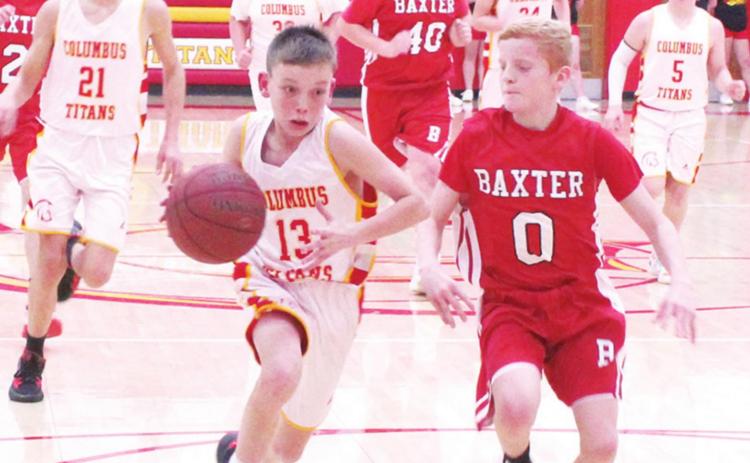 Titan Seventh Grader, Carter Woodcock, gets a break-away drive during the Central Titan 7A loss to Baxter Springs, January 6 at the Central Gym. Logan Abbott defends for the Lions. Drake Laurance, Brody Matson, Kooper Saiz, and Ethan Midgett trail for the Titans. Brooks Walker is in the mix for the Lions.
