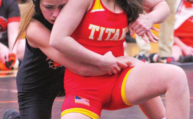 Grace Noel escapes her Independence opponent to win by pin over Riley Salisbury, January 25, at Independence.