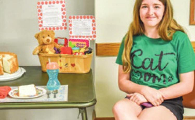 Wilson County Senior 4H member Ellen Meseraull placed first in the Wildcat District Favorite Foods Show. Her theme was babysitting and her food was angel food cake. Courtesy photo.