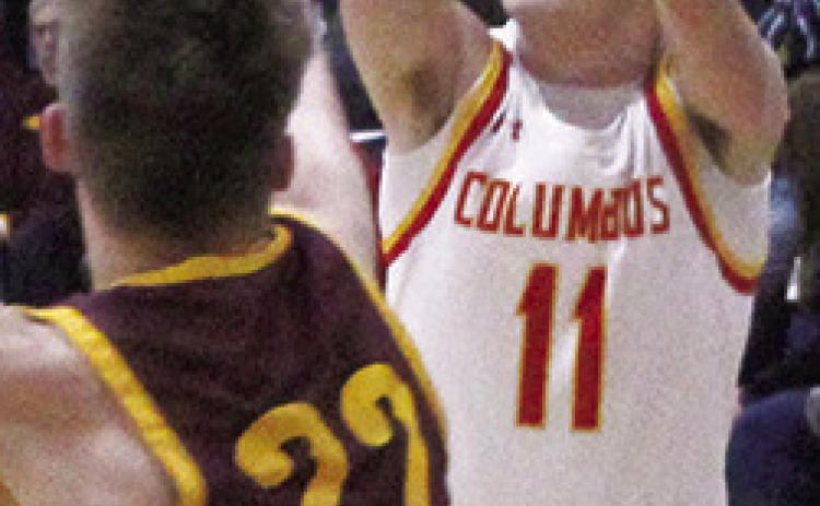 Titan Senior, Mack Kirk, shoots over Girard Senior, Tommy McDowell, in the 49-37, Titan win over the Trojans, Tuesday, in Columbus.
