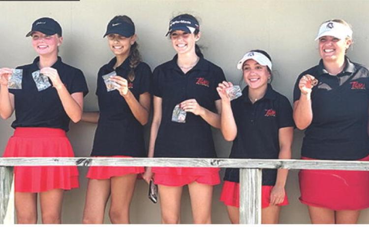 The Lady Titan Golf Team placed third in the Chanute Invitational Golf Tournament, Monday. Freshman, Cali Carpino, earned her first individual title to lead the team in the field of 45 golfers. Team members are Head Coach Jerry Smiley, Cali, Addison Johnson, freshman; Natalie Wary, junior; Hannah Noel, junior; Fallon Smiley, freshman; and Amory Neely, junior. Courtesy photo.