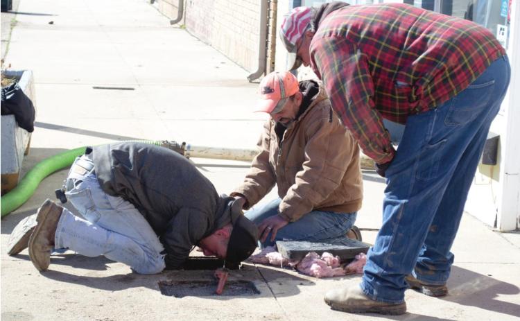 Public works employees were working on a water meter on South Pennsylvania Tuesday morning. Crews have been busy working on repairs since the severe cold weather caused some breaks and leaks.