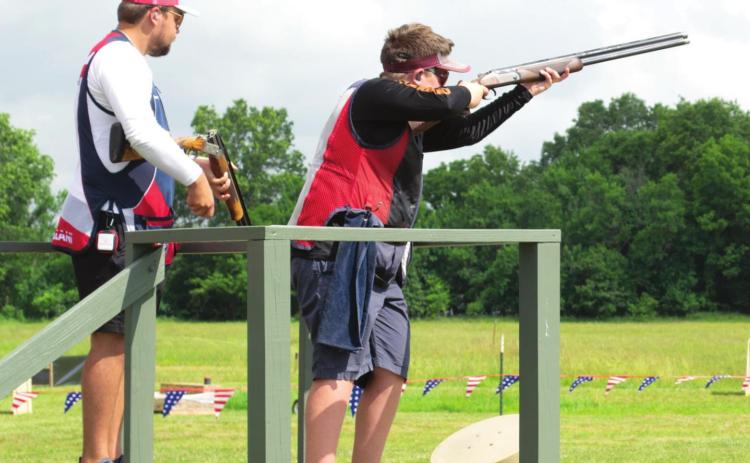 Eleven year old Noah Ruby (right) of San Antonio, Texas, was competing with the other shooters at 5-Stand competition on Tuesday morning. The young man has been shooting for the past four years. His family members do not compete, he became interested and is now competing with the best.