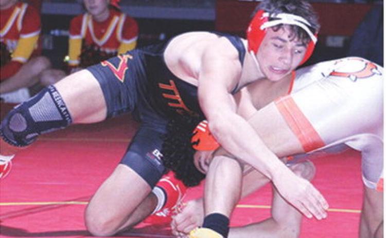 Titan Junior, Jayden Rodriguez, works to pin Kaeson Lewis, Independence, during the home team’s dual win, Tuesday, at the CUHS Gymnasium.