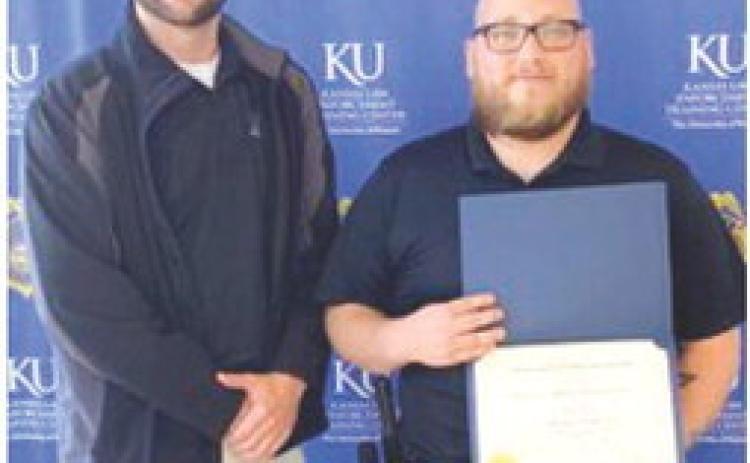 Marcus Harmon-Tsinhnahjinnie, 2015 graduate of Columbus Unified High School, recently graduated from the Kansas Law Enforcement Training Center. He is currently employed by Columbus Police Department. Sgt. Kyle Clark attended the graduation ceremony. Courtesy photo.