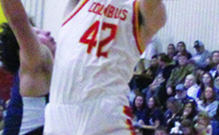 Titan Senior, Seth Stover, goes to the basket over Galena Senior, Ty Hall, in the 40-29, Bulldog win in Columbus, Friday.